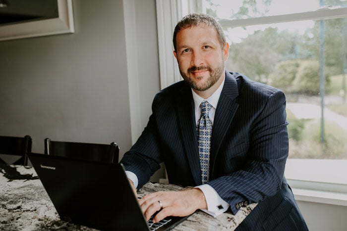 Attorney Andrew Popp sitting at his computer